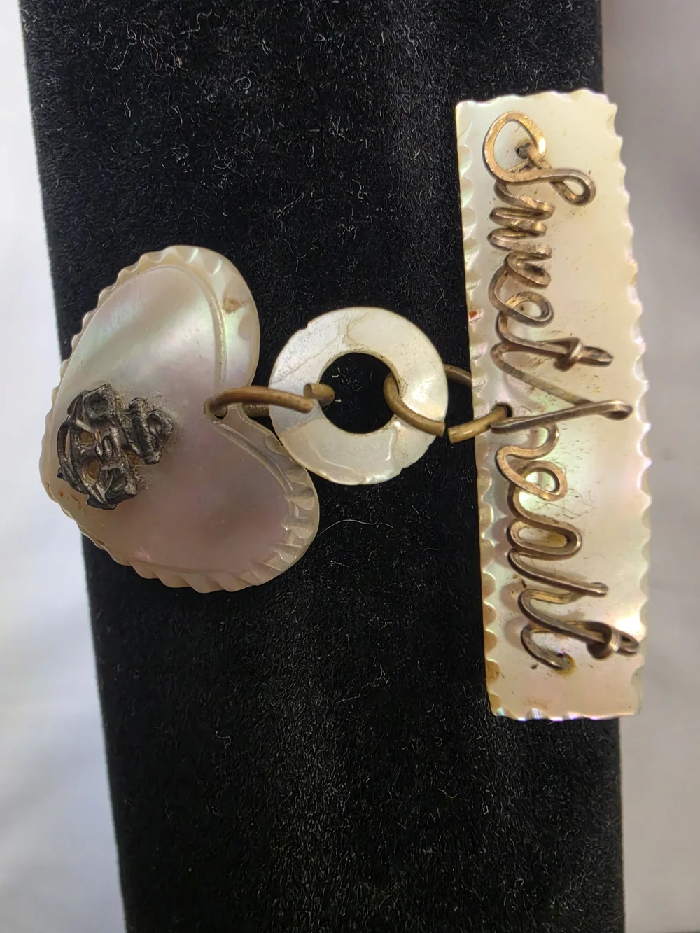 Vintage World War II-era U.S. Navy sweetheart brooch, made from carved MOP